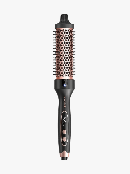 Black buttoned brush with heating component on a light gray background