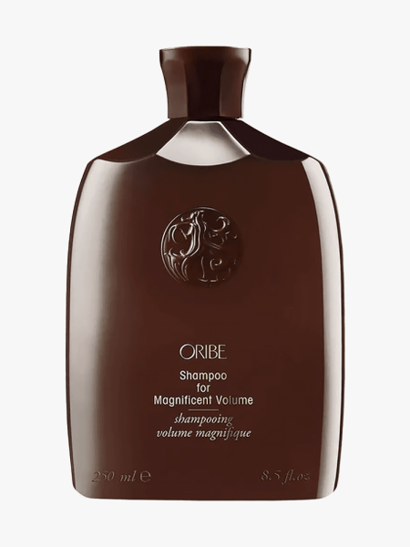 Oribe Magnificent Volume Shampoo in brown branded bottle component on a light gray background