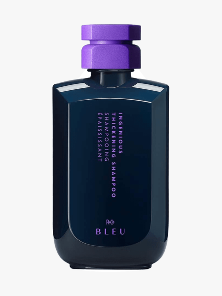 R+Co Ingenious Thickening Shampoo in branded component on a light gray background